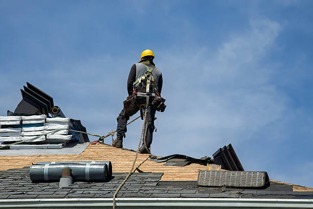 Professional Gutter Installation technician working in Ames, TX